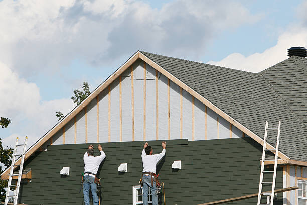 Professional Storm Damage Siding Repair technician working in Auburn, IN